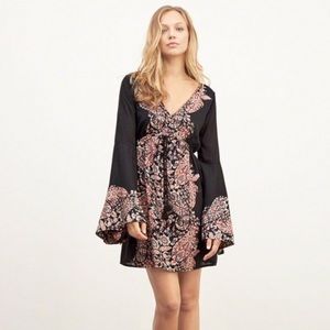 Peasant dress with bell sleeves and low back